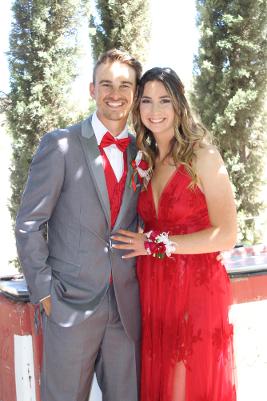 red prom dress with grey tux